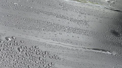 Close up of rain drops on black cover background. Stock Footage 295036903