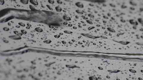 Close up of rain drops on black cover background. Stock Footage 295036914