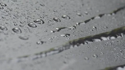 Close up of rain drops on black cover background. Stock Footage 295036923