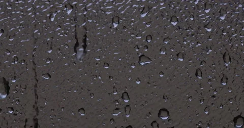 Close up on rain drops dripping onto a window pane 스톡 동영상 156966113
