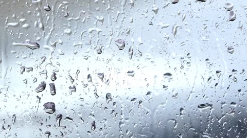 Close-up rain drops on glass surface Video stock 249475431