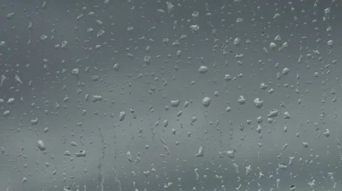 Close Up of Rain Drops Splattering on Window in Storm Stock Footage 54731817