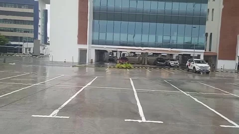 Close-Up of Rain Falling on Car Windshield, Video of Water Drops on Glass Stock Footage 304337561