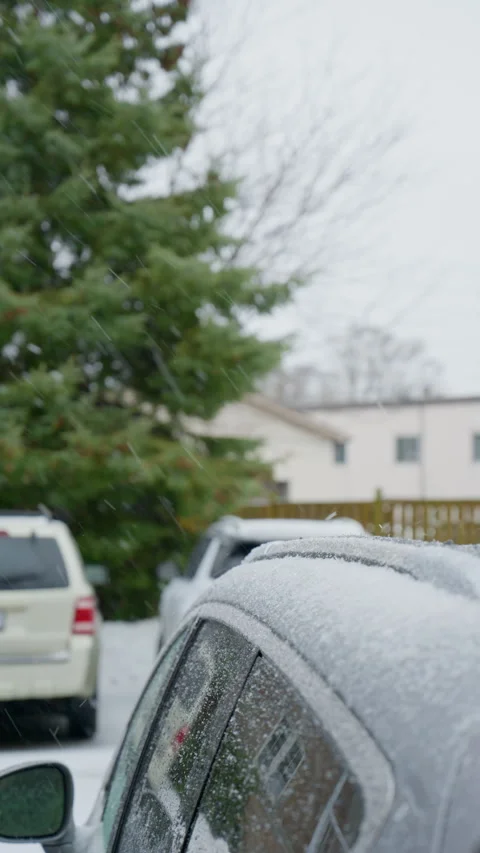 Close-up of rain, snow, hail, and sleet falling on the car roof Stock Footage 329192517