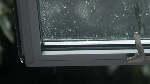 Close up of Rain through Window Stock Footage 135684873