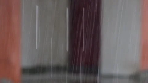 Close up of rain water with a building wall in the background Stock Footage 291554008