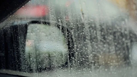 Close up of rain water drops on windscreen window Stock Footage 86958580