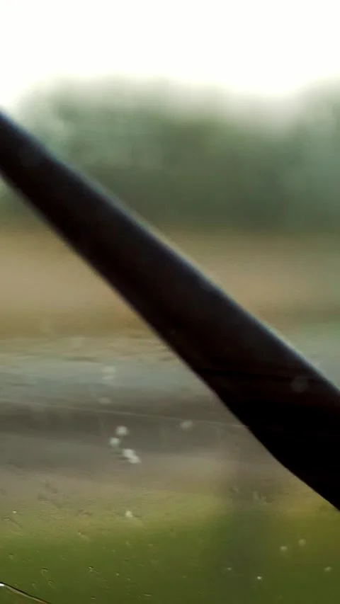Close-up, rain, work of car wipers, Windshield wipers from inside of car, Car Stockbeeldmateriaal 317846962