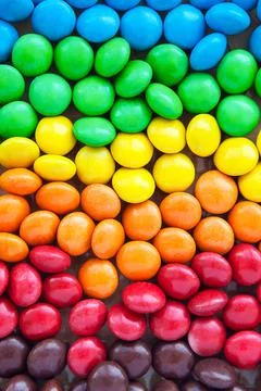 Close up of rainbow colored candy, sugar coated candies. Candy delicious swee Foto stock