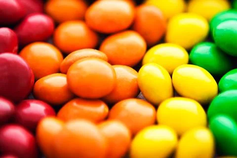 Close up of rainbow colored candy, sugar coated candies. Candy delicious swee Stock Photos