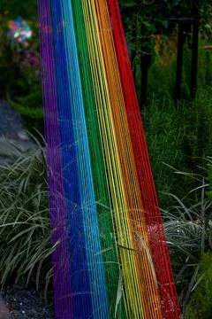 Close-up of rainbow colored thread art installation Foto stock