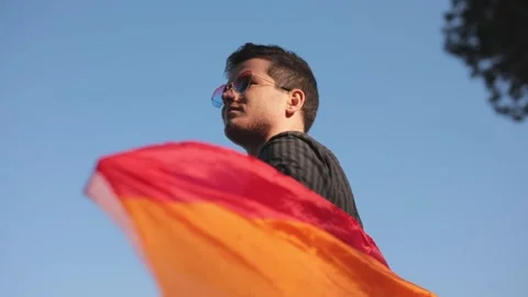 Close up The rainbow flag, LGBT pride flag gay pride flag waving in the wind Stock Footage 133676560