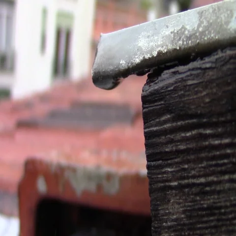Close-up of a raindrop on a roof Stock Footage 69514389