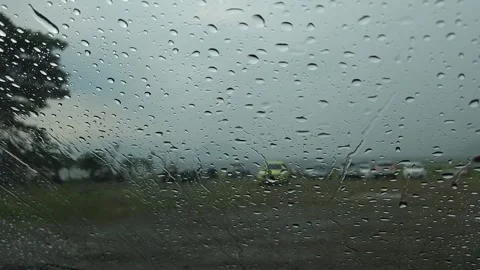 Close-up of raindrops on car window Stock Footage 266216329