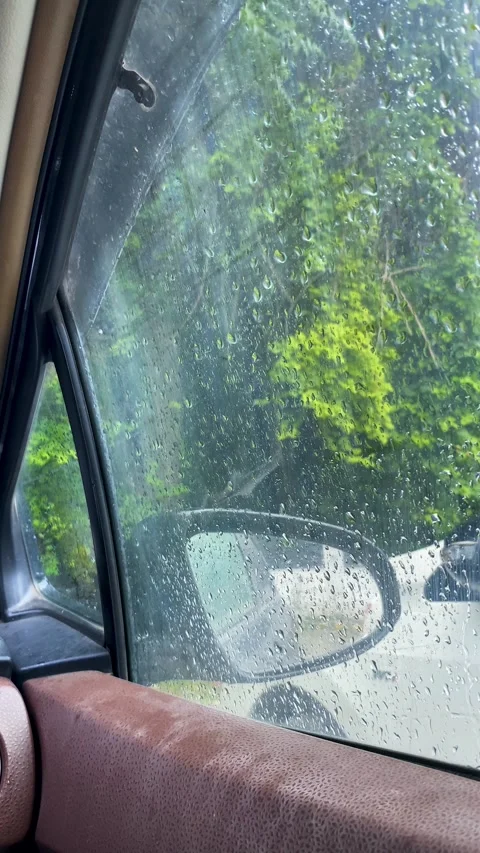Close-up of Raindrops on Car Window Stock Footage 332081464
