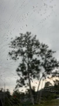 Close-up of raindrops on car window Stock Photos