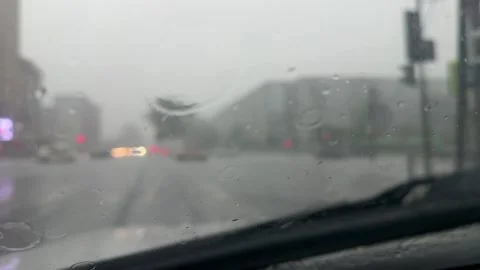 Close up of raindrops on a car windscreen 動画素材 346164587