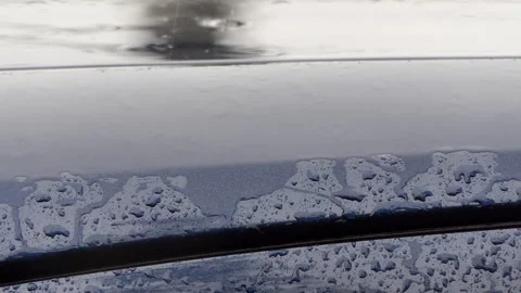 Close-up raindrops falling on the car Video stock 249477135