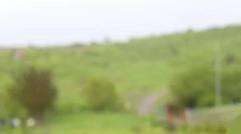Close up of raindrops falling on a glass window Stock Footage 63377499