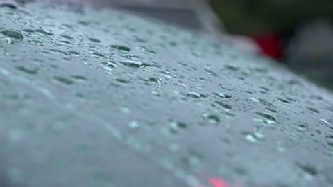 Close up raindrops flow down from clear car glass. Slow motion 4K Video stock 221220411