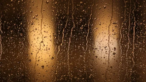 Close-up: Raindrops flow down the window. Rainy jazz. Video stock 100382129