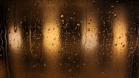 Close-up: Raindrops flow down the window. Rainy jazz. Video stock 100382595