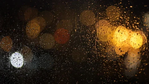 Close-up: Raindrops flow down the window. Rainy jazz. Video stock 100384582