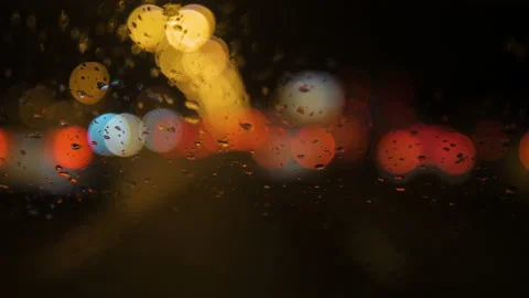 Close-up of raindrops running down the windshield of a car 스톡 동영상 169388768