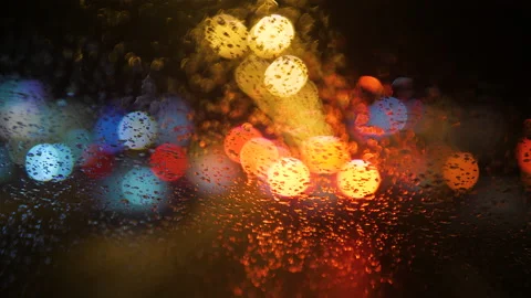 Close-up of raindrops running down the windshield of a car 스톡 동영상 169390124