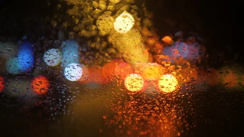 Close-up of raindrops running down the windshield of a car 스톡 동영상 169390294