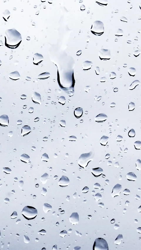 Close-up of raindrops on a window pane Video stock 232683717