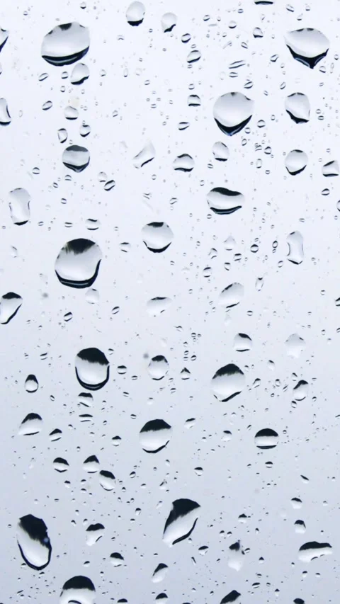 Close-up of raindrops on a window pane Video stock 232683734