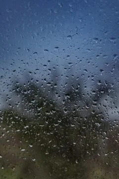 Close up of raindrops on a window on a rainy day Stock Photos