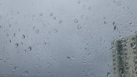 Close up raindrops on window with shallow depth of field abstract rainy texture Stock Footage 331347331