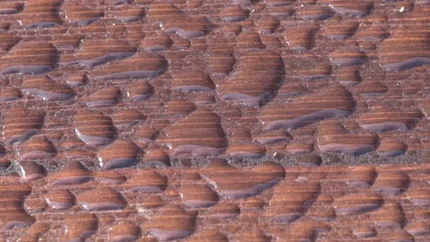 Close-up of raindrops on a wooden bench Stock Footage 221167958