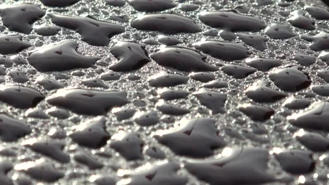 Close-up of raindrops on a wooden bench Stock Footage 221167962