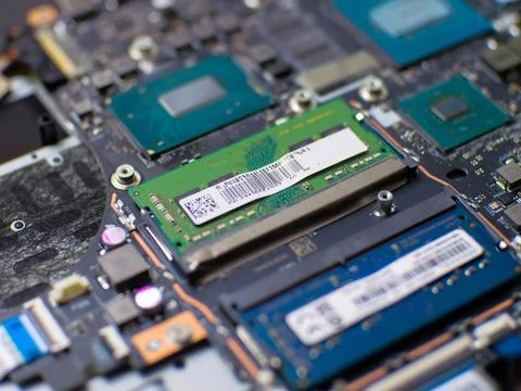 Close up of RAM modules being installed on a laptop motherboard Stock Photos