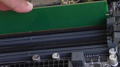 A close-up of the RAM (Random Access Memory) installation on a computer Stock Footage 333106588