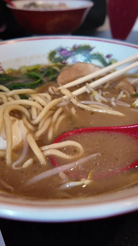 Close-Up of Ramen Bowl with Egg and Bean Sprouts Stock Footage 308577862