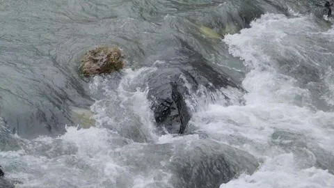 Close-up rapid flow of water among stones in mountain river Stock-Footage 295037848