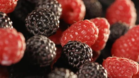 Close-up of raspberries and blueberries. Loopable. Stock Footage 39987857