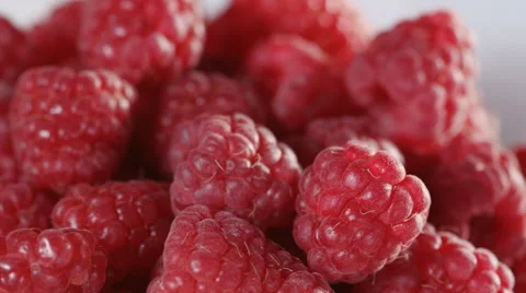 Close-up of raspberries on light background. Loopable Stock Footage 39977132