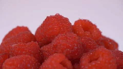 Close up of Raspberries Rotating over white Background. Raspberries, berries Video stock 127905042