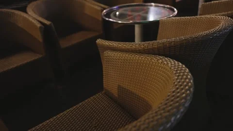 Close Up Rattan Wicker Texture and tables shifted together at Outdoor Cafe Night Stock Footage 338369423