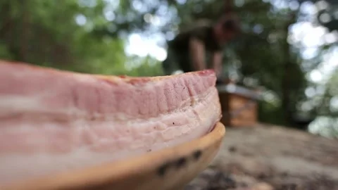 Close Up on Raw Bacon with Person in the Background Video stock 280123736