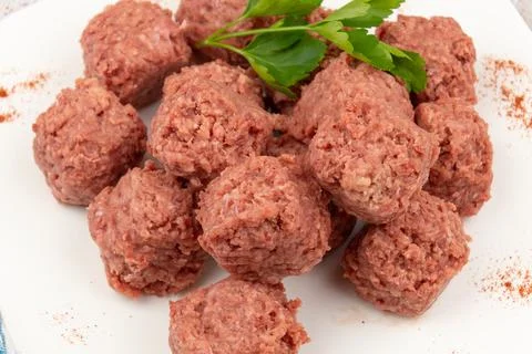 Close up of raw beef dumpling in white plate Stock Photos