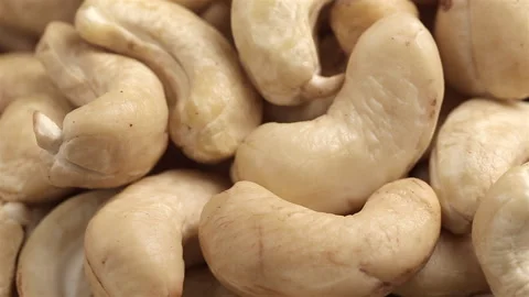 Close up of raw cashew nuts top view rotation Stock Footage 167926086