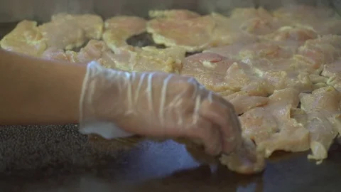 Close up of raw chicken being cooked Stock Footage 73883264