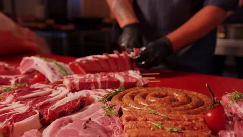 Close-up raw chopped lamb ribs on red cutting board. Stock Footage 295273506