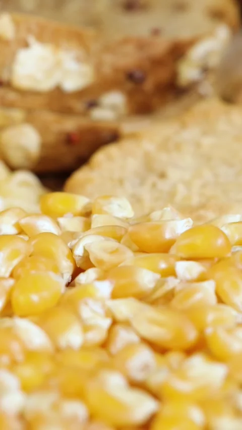 Close-Up of Raw Corn Kernels with Bread Background Video stock 310986738